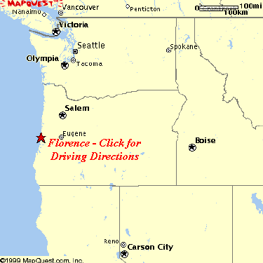 Traveler using a compass with a map in Oregon